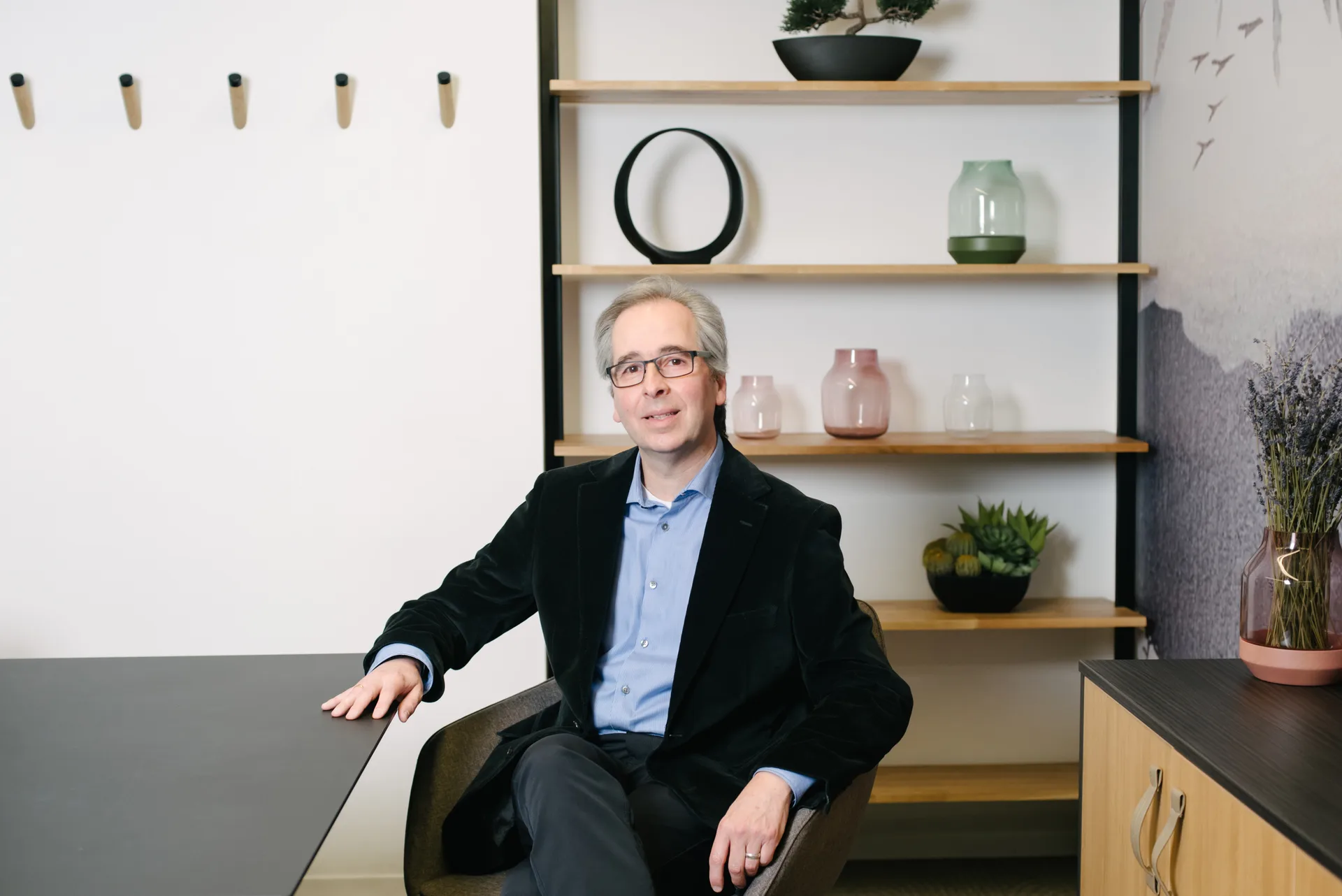 Gary Toste, co-founder of CanadaSDS, seated at a desk in the Quadshift office